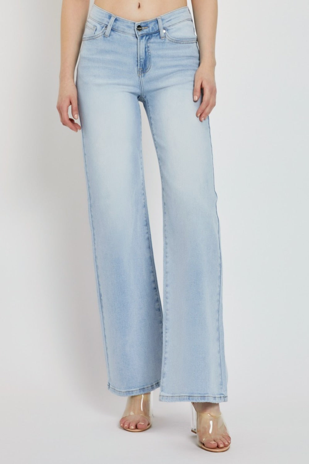 Model wearing RISEN wide leg high-rise jeans